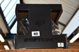 An as new Fox Racing Dropframe Pro Helmet, CE in black (S).