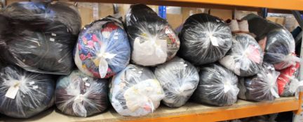 Thirteen bags of assorted clothing and related items.