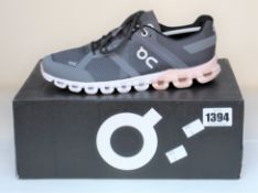 A pair of woman's as new On Cloud running shoes (UK 4).