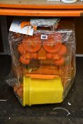 A Mr.Orange 2000M automatic orange juicer.
