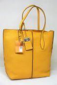 An as new TOD'S shopping tote SFOD Piccola bag with dust cover.