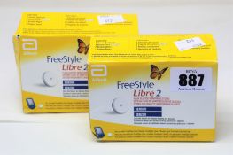 Two as new boxes of FreeStyle Libre 2 sensor packs.