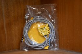 An as new Turck inductive proximity sensor (Ni4-DS20-2AP6X2, 165022).