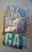 Two sets of seven as new netball bibs (Size M) one set in red and one set in green.
