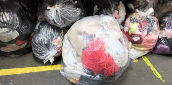 Twelve bags of assorted clothing and related items.