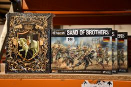 Three as new Band of Brothers Bolt Action WWII starter sets and a Waterloo 2nd edition starter set