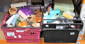 Two boxes of assorted toiletries to include shower gels, shampoos, scrubs and creams.