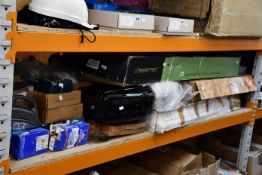 A shelf of assorted car parts and related items.