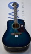 A pre-owned Walden D450US Dreadnought Acoustic Guitar in teal with a Gator Case.