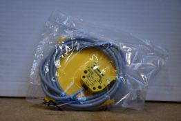 An as new Turck inductive proximity sensor (Ni4-DS20-2AP6X2, 165022).