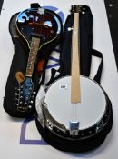A pre-owned Stagg mandolin with case and an as new Vangoa banjo with case.