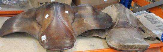 Two pre-owned unbranded horse saddles.