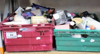 Two boxes of assorted toiletries to include shower gels, shampoos, scrubs and creams.