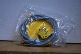 An as new Turck inductive proximity sensor (Ni4-DS20-2AP6X2, 165022).