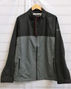 A men's as new Under Armour storm proof grey and red trim jacket (Size LG/G).
