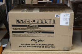 A Whirlpool PRO 25IX Commercial 1000W Microwave.