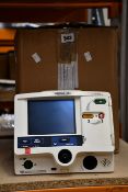 A pre-owned Lifepak 20e defibrillator (REF: 99507-000095, SN: 3202487-317, Rx Only).