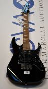 An Ibanez Gio Mikro electric guitar in black (Guitar has some damage).