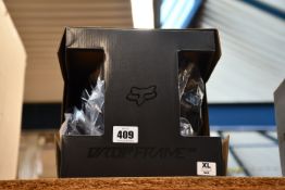 An as new Fox Racing Dropframe Pro Helmet, CE in black (XL).