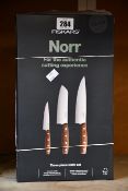 Three Fiskars Norr three piece knife sets.