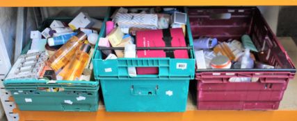 Two boxes of assorted toiletries to include shower gels, shampoos, scrubs and creams.