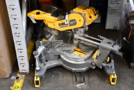 A pre-owned DeWalt DHS780 XR Flexvolt Mitre Saw (Some minor damage).