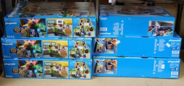 Five Playmobil 5552 ferris wheels and a Playmobil 5554 spinning spaceship ride with lights.