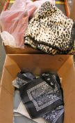 A quantity of ladies printed leopard print and red capes (Approximately 30 items) and a quantity