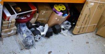 Assorted weights/weight training accessories.