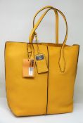 An as new TOD'S shopping tote SFOD Piccola bag with dust cover.