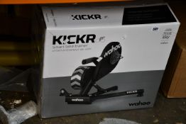 A boxed as new Wahoo Kickr smart bike trainer.