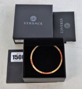 A pre-owned Versace DG0H477 DJMX Greca crystal bracelet in pink.