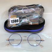 Three pair of Anne & Valentin titanium various coloured glasses frames with cases.