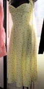 An as new House of CB London Alicia dress in lemon floral print (S).