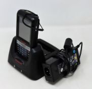 A pre-owned Honeywell Dolphin 60s Mobile Computer Barcode Scanner with cradle and power supply.