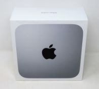 A boxed as new Apple Mac Mini with Apple M1 processor, 16GB, 512GB SSD storage in silver