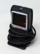 A pre-owned Honeywell Genesis 7580G-2 1D 2D USB Presentation Barcode Scanner.