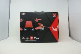 A boxed as new MJX Bugs 8 Pro RTF Quadcopter Drone (UK plug adapter required) (Damage to box).
