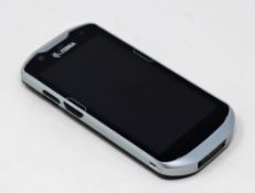 A pre-owned Zebra TC57 Handheld Computer Barcode Scanner (P/N: TC57HO-1PEZU4P-27).