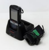 A pre-owned Honeywell Dolphin 60s Mobile Computer Barcode Scanner with cradle and power supply.
