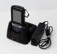 A pre-owned Honeywell Dolphin 60s Mobile Computer Barcode Scanner with cradle and power supply.