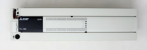 A boxed Mitsubishi MELSEC FX3U-128M programmable controller (box open, appears new)