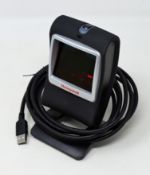 A pre-owned Honeywell Genesis 7580G-2 1D 2D USB Presentation Barcode Scanner.