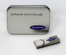 An as new Amplivox Audibase 5.5.101 Audiogram Database Software and Manuals USB Flash Drive in metal