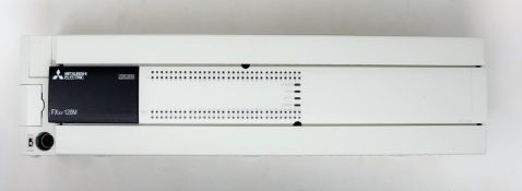 A boxed Mitsubishi MELSEC FX3U-128M programmable controller (box open, appears new).