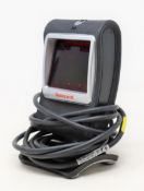 A pre-owned Honeywell Genesis 7580G-2 1D 2D USB Presentation Barcode Scanner.