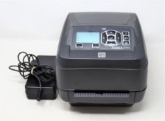 A pre-owned Zebra ZD5000 USB/Serial/Parallel/Ethernet 300dpi Desktop Thermal Label Printer (P/N:
