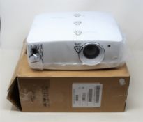 A boxed as new Optoma UHD38 DLP Projector (Box opened).