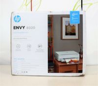 A boxed as new HP Envy 6020 inkjet printer in white. (box damaged)