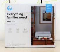 A boxed as new HP Envy 6020 all-in-one printer in white